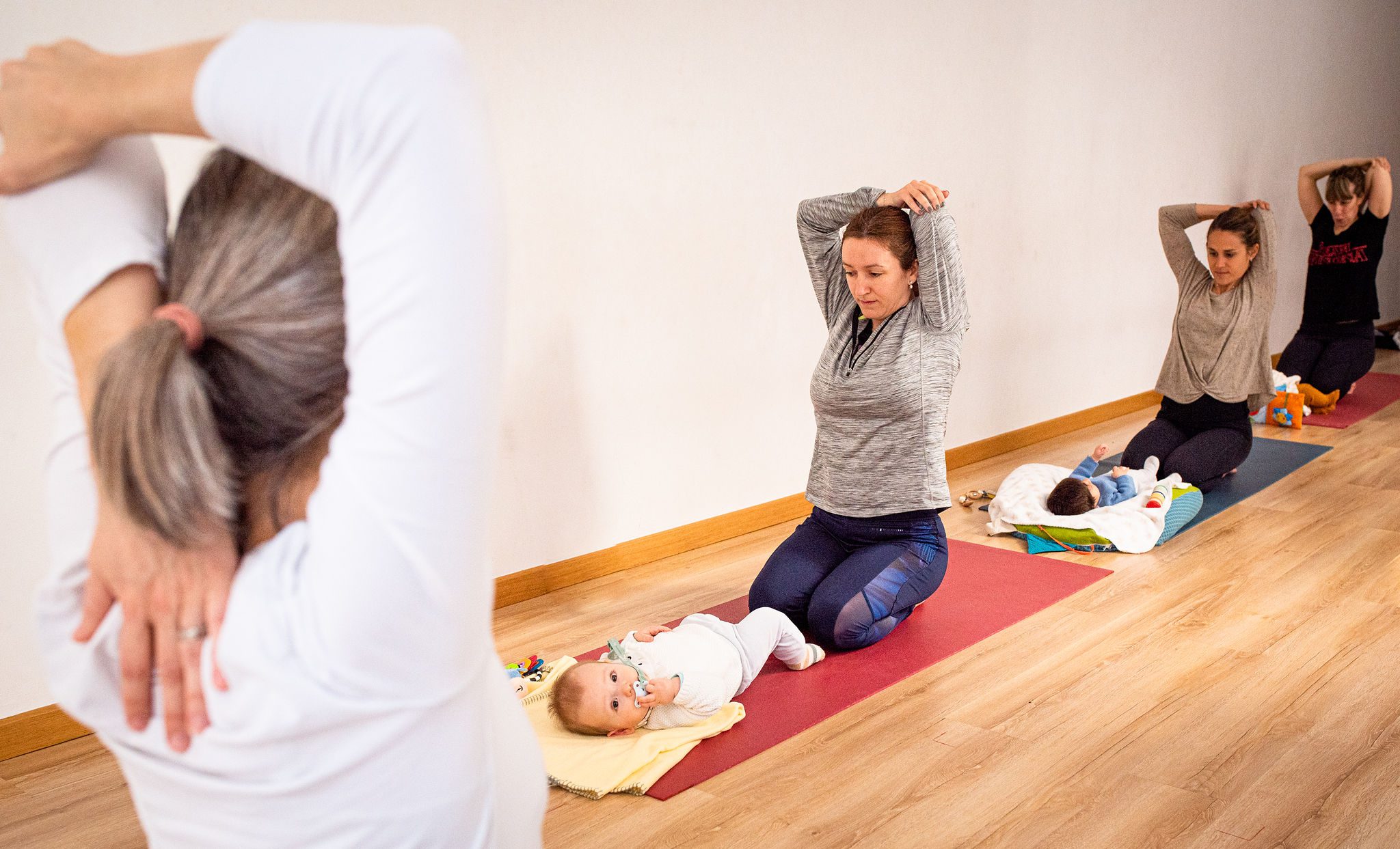 women practicing yoga after childbirth